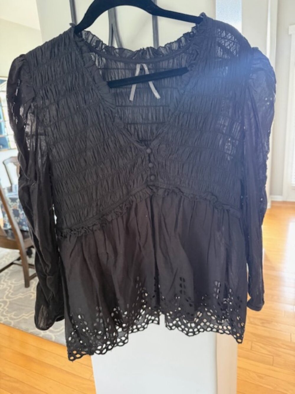 Eyelet bottom Black blouse by Anthropologie